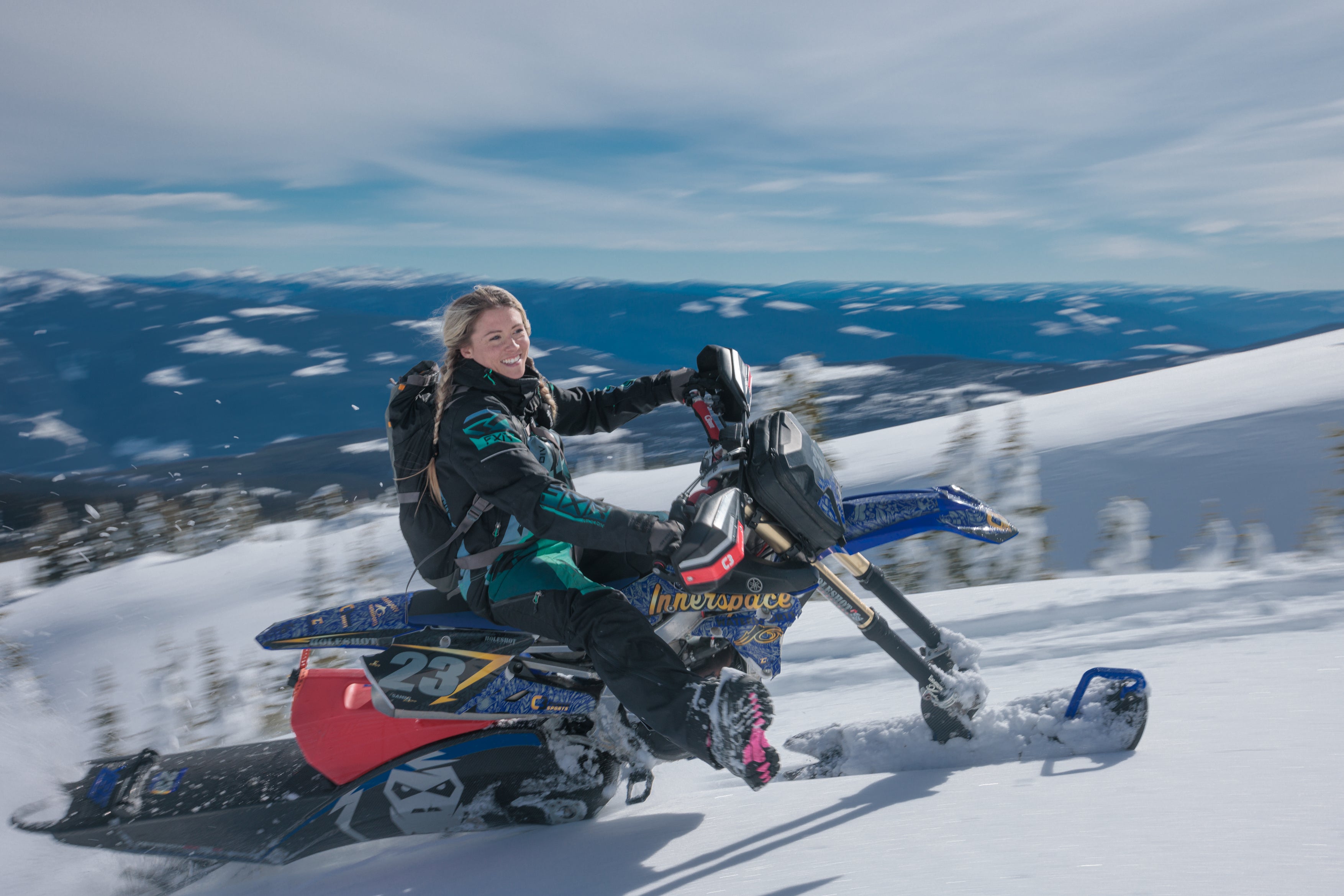 lady riding on innerspace snowbike