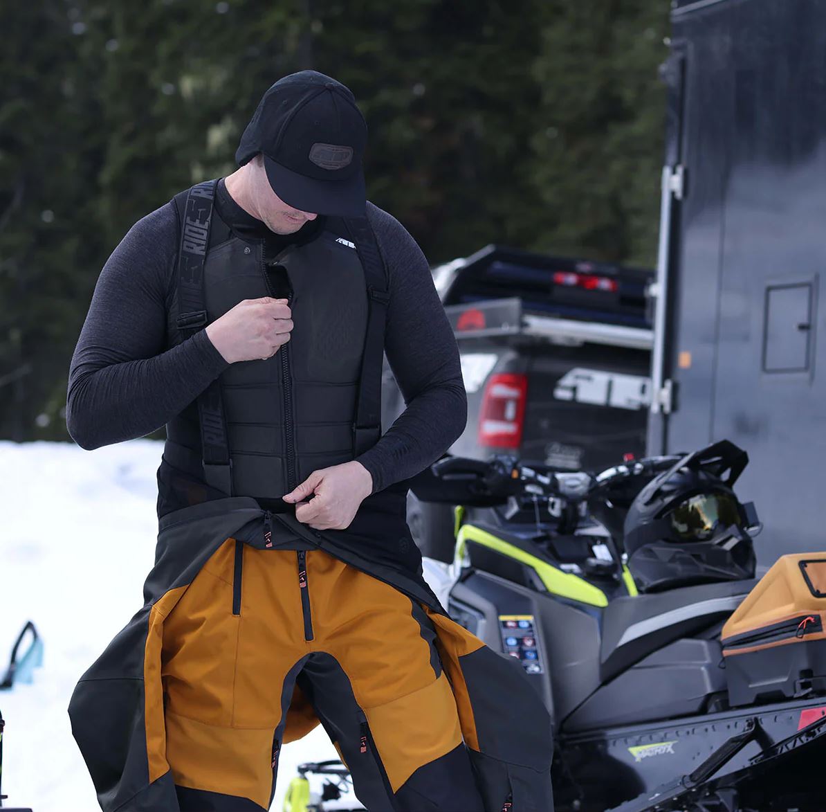 Man putting on Snowmobile Armor