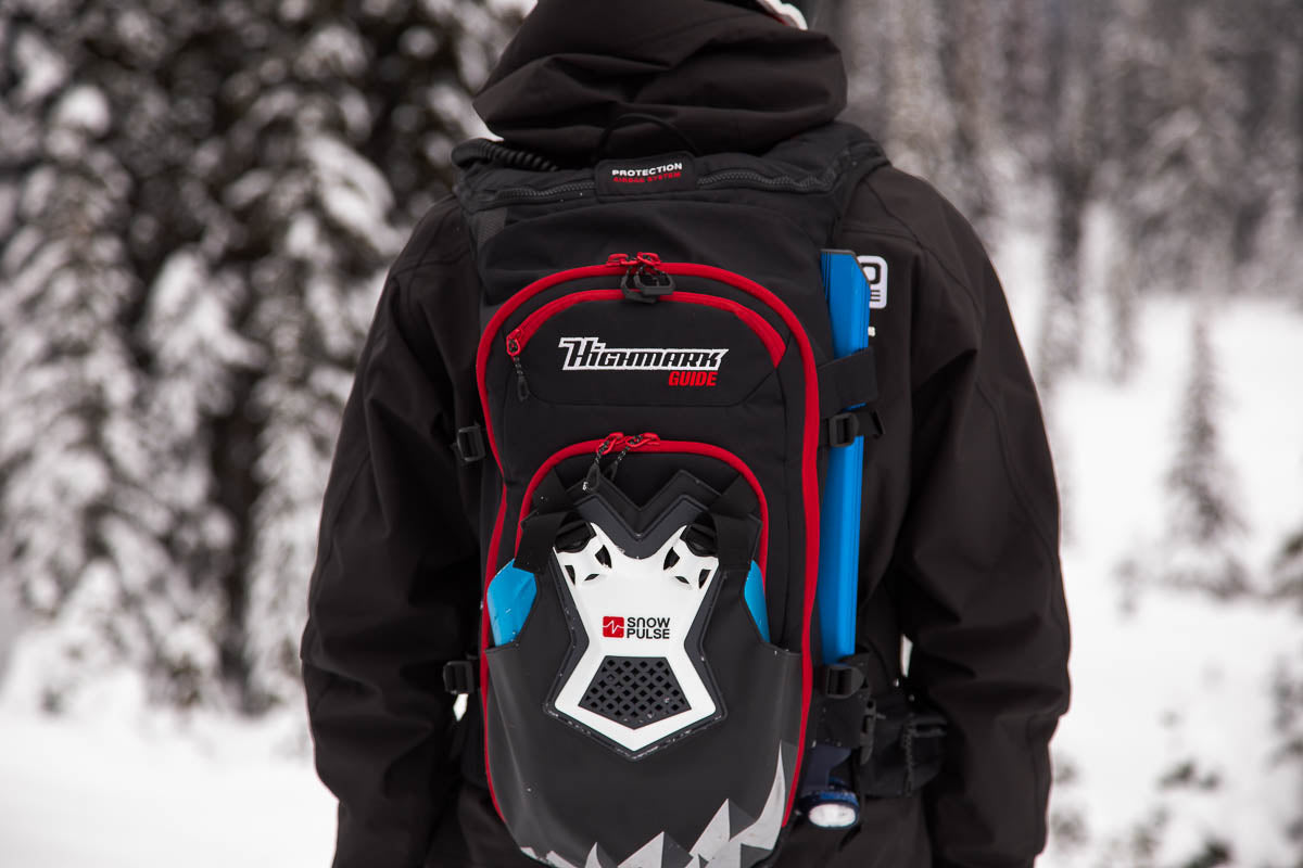 Back of man with Highmark avalanche bag